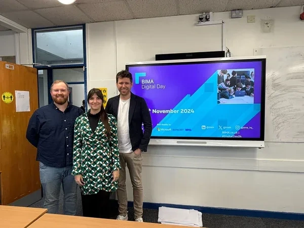 Our team members standing in a classroom during BIMA Digital Day 2024 at Steyning Grammar School