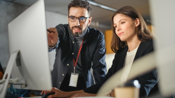 Man and women at computer